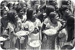 Circa 1949, a crowd of girls at the Mary Immaculate orphanage, in Tirupattur in the North Arcot district of Madras State, have just received bowls of rice provided by UNICEF.