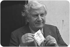 In 1986 in Germany, UNICEF Goodwill Ambassador Peter Ustinov holds up a packet of oral rehydration salts, the key component of oral rehydration therapy.