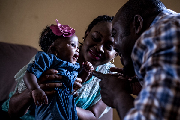 In Nigeria, Remi Falayi (centre), with her husband and daughter, 3-month-old Oluwatomini, has adjusted her work schedule so she can breastfeed her child.