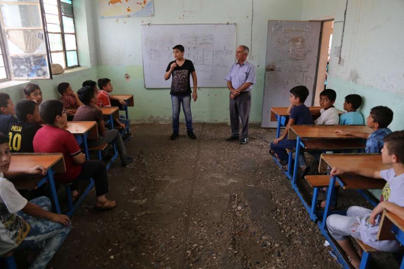 iraq-boys-damaged-classroom-un019291-med-res.jpg