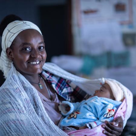 Kokobe Ashebir, 20, has a two month old baby. She's attending a routine check-up with Workitu Abera, a health worker at Kolabe Bale Health Post in Sire, Oromia Region, Ethiopia.