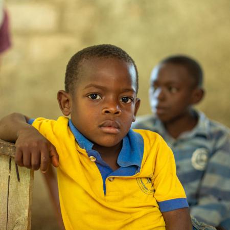 A boy poses for a portrait during an interview with the beneficiaries of the clean water program run by UNICEF in Deye Morn, Jeremie, Haiti, Thursday, March 23, 2023.