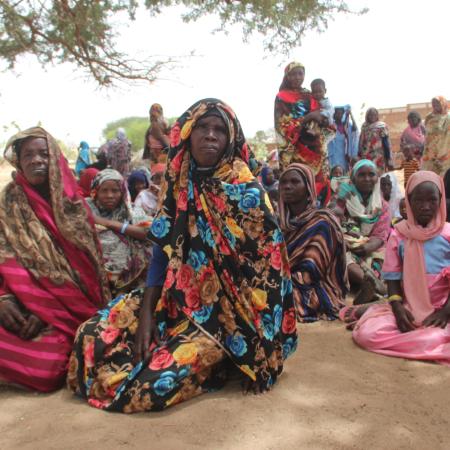 On 27 April 2023, as conflict escalates in Sudan, a group of refugees, mostly women and children, rest under a tree to protect themselves from the high temperatures after crossing into the Chadian village of Koufroun, which is situated on the Chad-Sudan border.