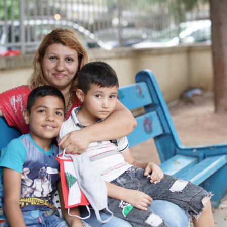 On 1 September 2020, Kevin, 8 years old, left, with his mother Nadida Kayyal Bakli and brother at the UNICEF's children friendly space (CFS) at the Karantina public garden in Beirut, Lebanon.