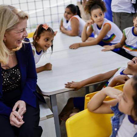 On 30 August 2023 in Brazil, UNICEF Executive Director Catherine Russell shares a good laugh with a student while visiting the CEMEI 8 de Março school in the Ibura neighbourhood of Recife.