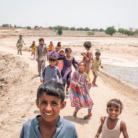 Children seen on the street in the inundated region of Geokaloi Village in the Southern Pakistani province of Sindh.