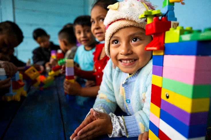 Children in Guatemala playing with building blocks