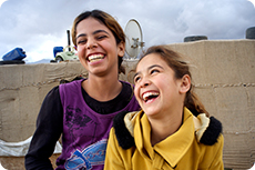 Two girls laughing