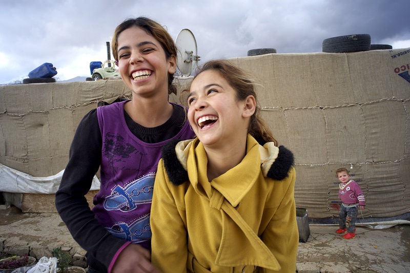 Two girls laughing
