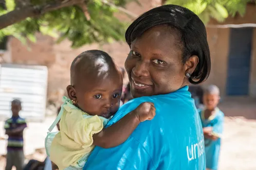 an UNICEF representative with a baby