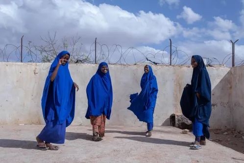 Four girls play in the courtyard of their primary school in Somalia.