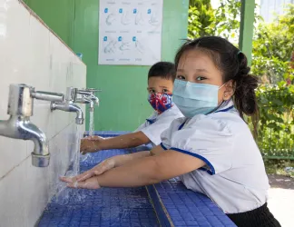 Child washes hands