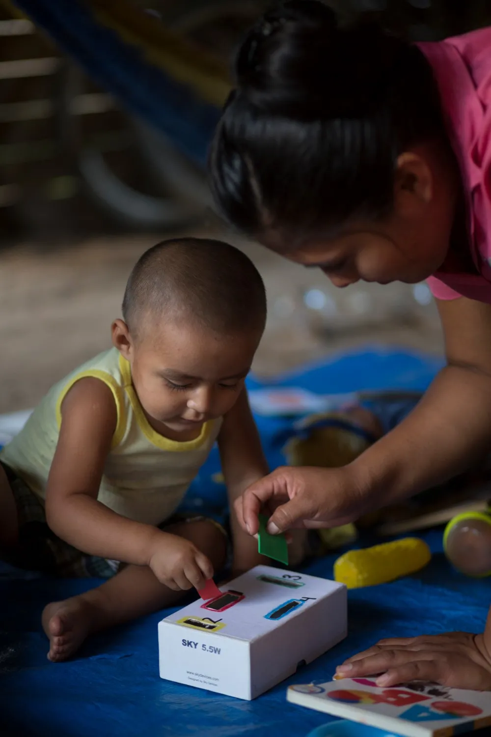 Abner, in San Felipe, enjoys playing with the various learning materials and toys.