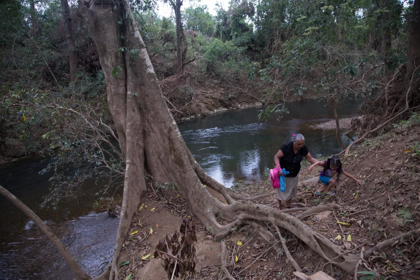 Allizon loves to play at a nearby river with her great-grandmother. 