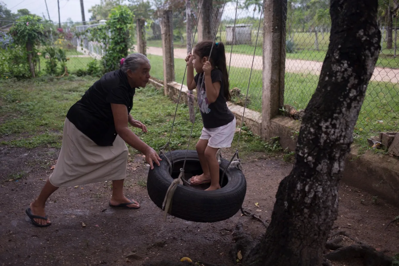 Conzuelo Flores in the country’s Cayo District, is raising her great-granddaughter, 4-year-old Allizon Stefany Escobar.