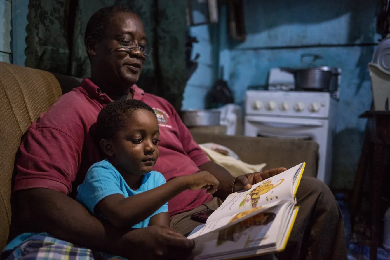 Marshall Mejia, reading to Orin.
