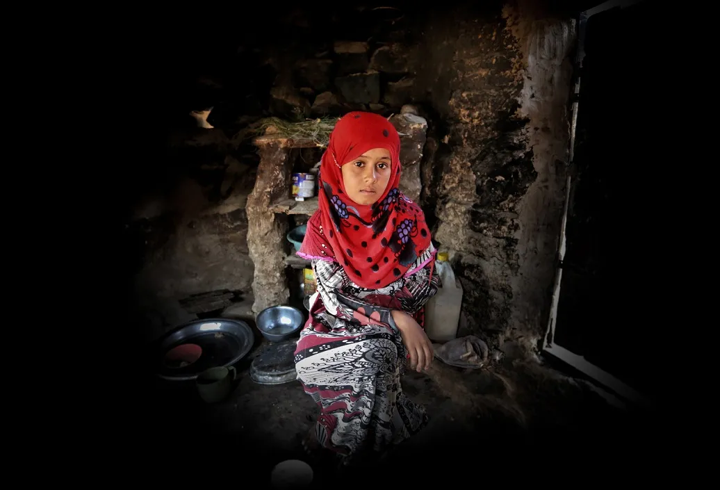 A Yemeni girl collects water from far away