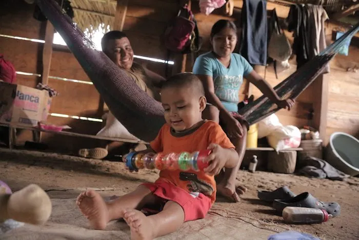 Abner, 2, at home in San Felipe Village in the Toledo region of Belize, playing with a toy provided by a UNICEF-trained "roving caregiver." Credit: © UNICEF/UN032041/LeMoyne