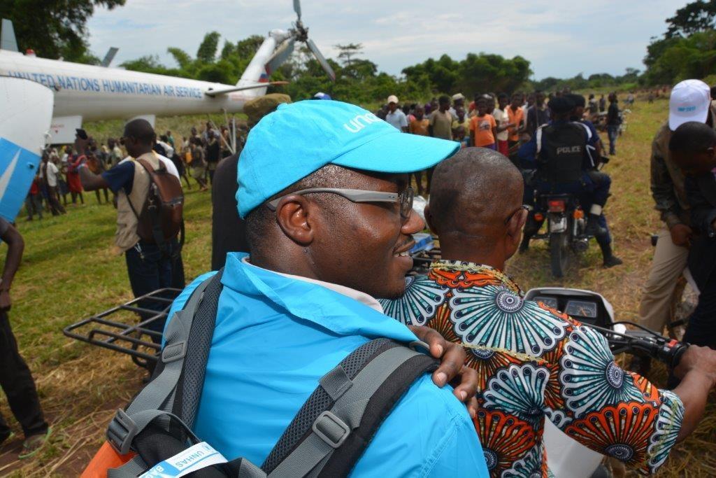 Dr Oyewale on the back of a motorbike as he’s taken to the Ebola response centre in Likati, DRC.