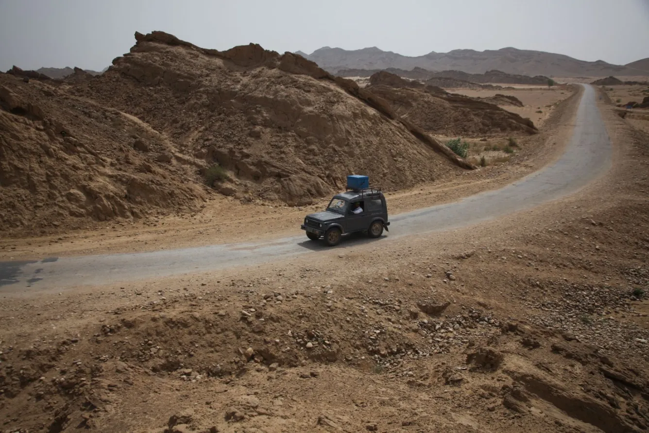 A box filled with polio vaccines sits on a jeep in regional Pakistan