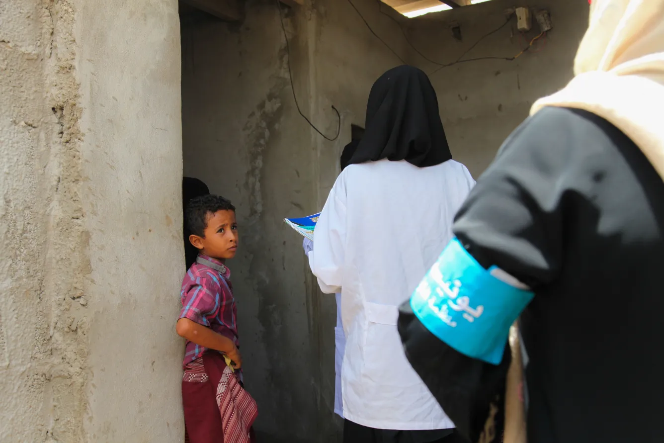 community volunteers visit a home