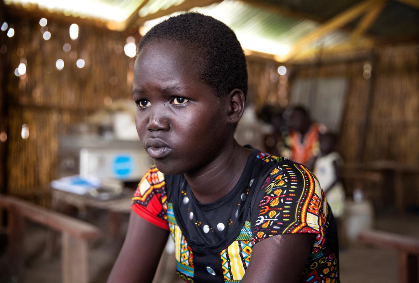 Mary, 15, a student at the primary school.