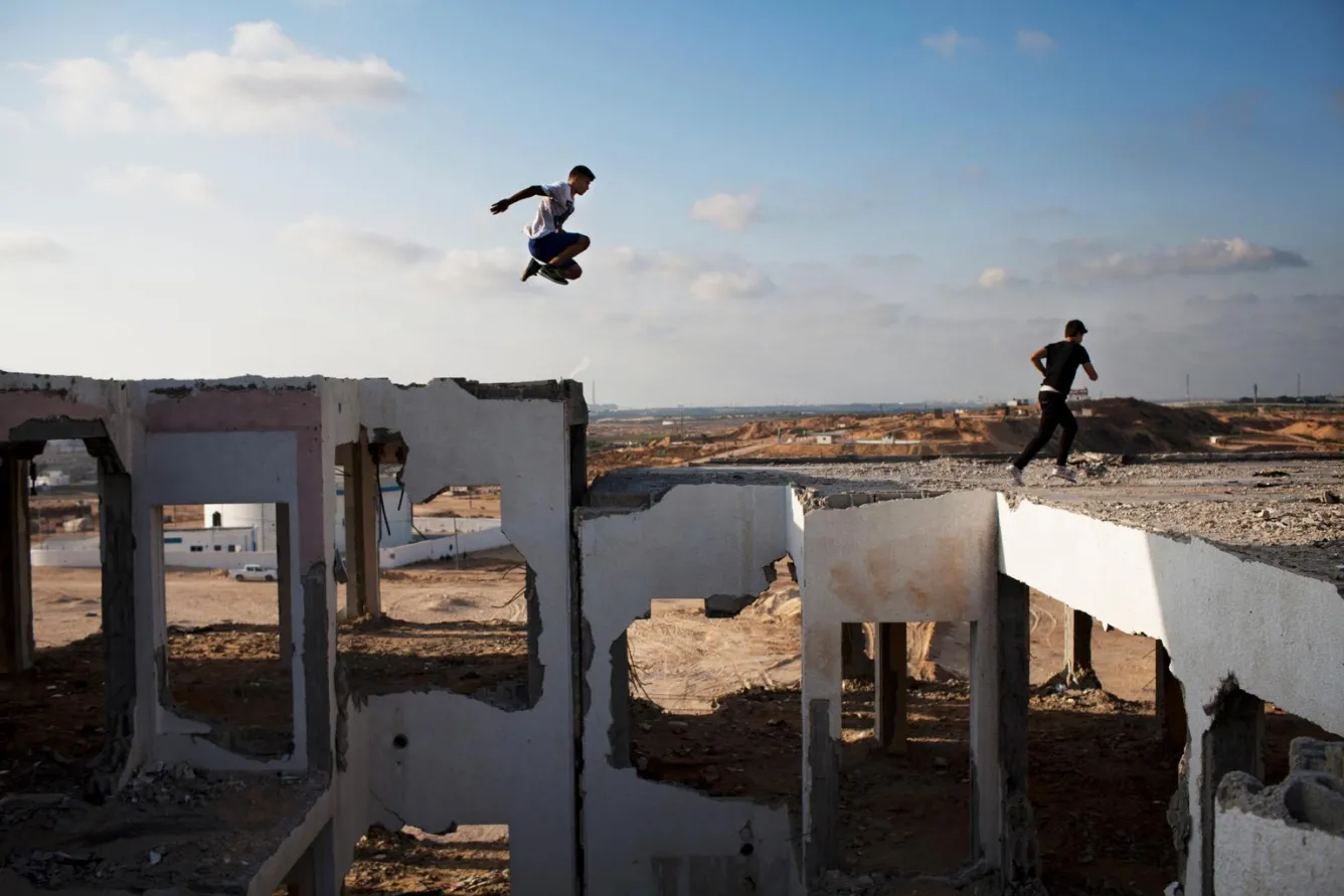 Boys perform parkour in Palestine