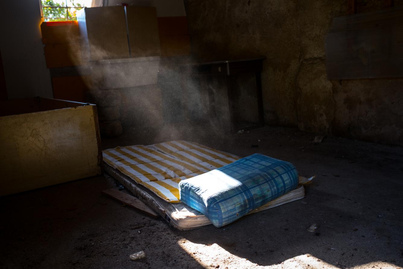An abandoned farmhouse with a mattress used by prostitutes in Palermo.
