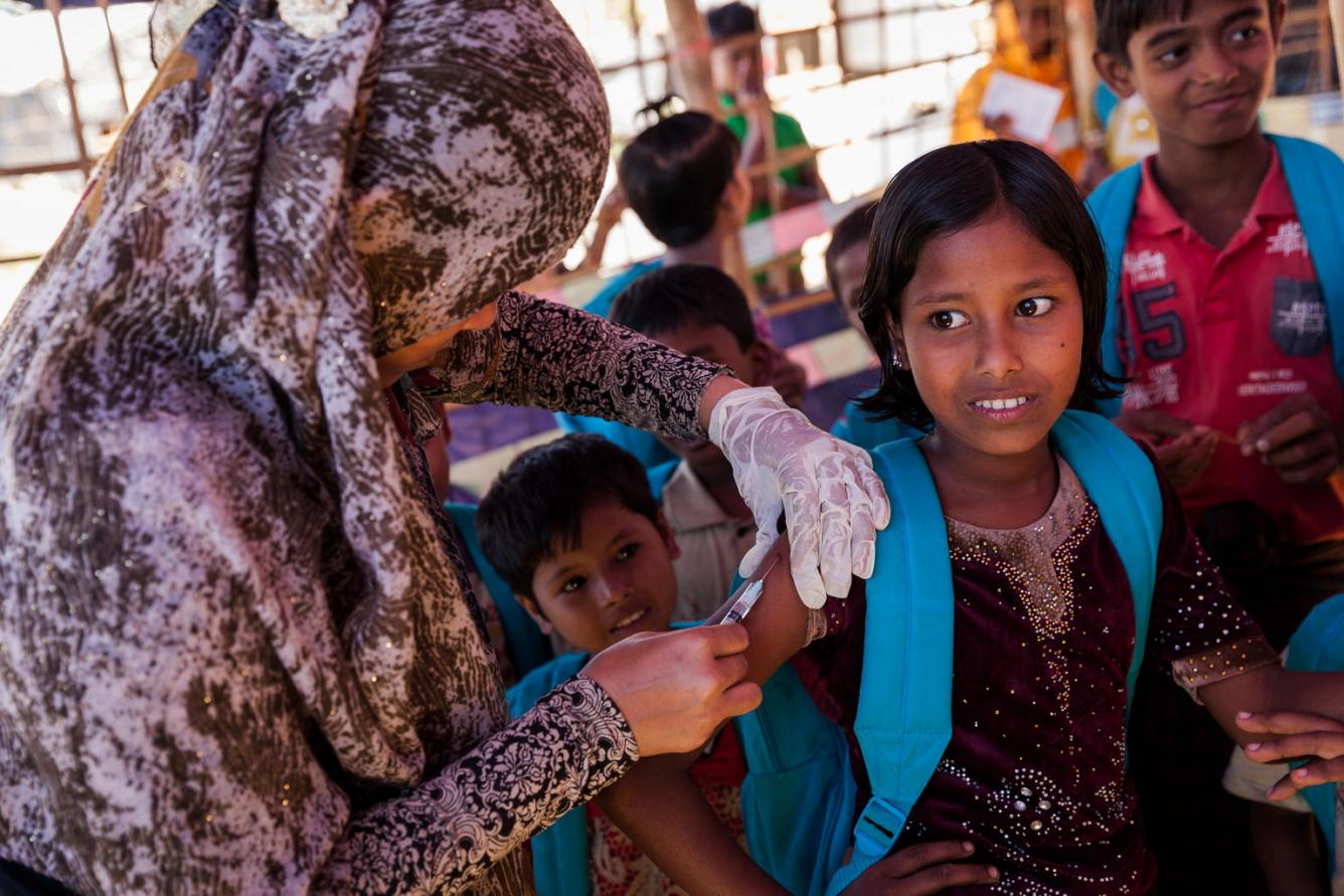 Rohingya children receiving vaccinations