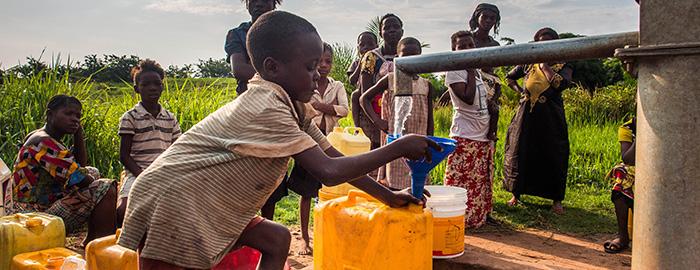 A young boy fetching drinking water