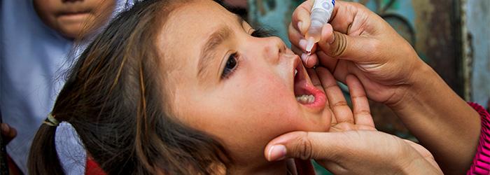 girl receiving polio vaccine