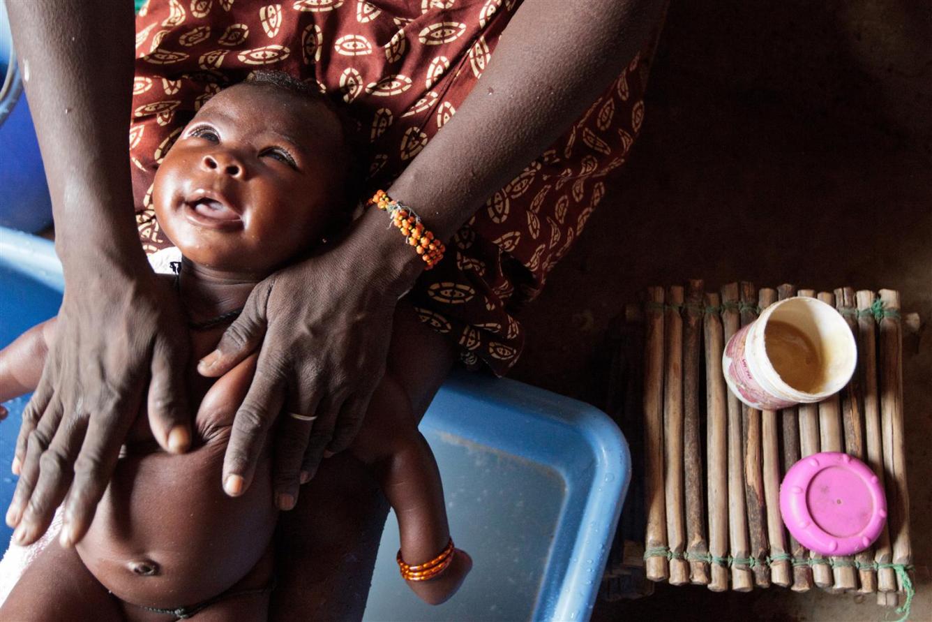 Baby bathing in Burkina Faso