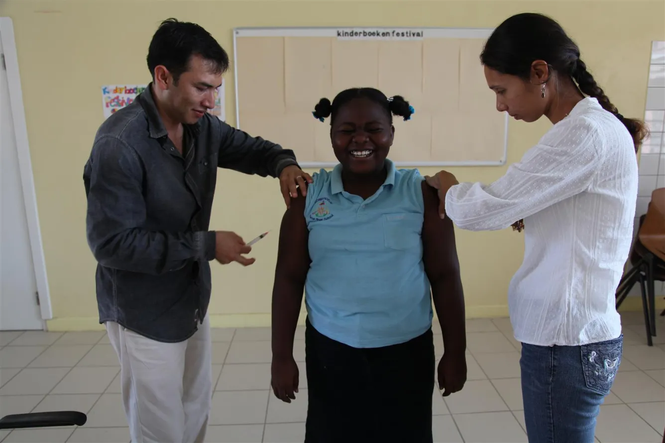A girl is vaccinated in Oranjestad, Aruba.