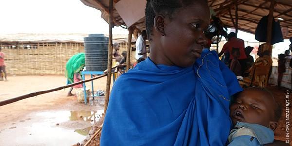 Monica, South Sudan, holds her son Mubarek