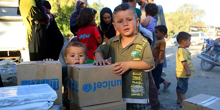 Boys receive humanitarian supplies