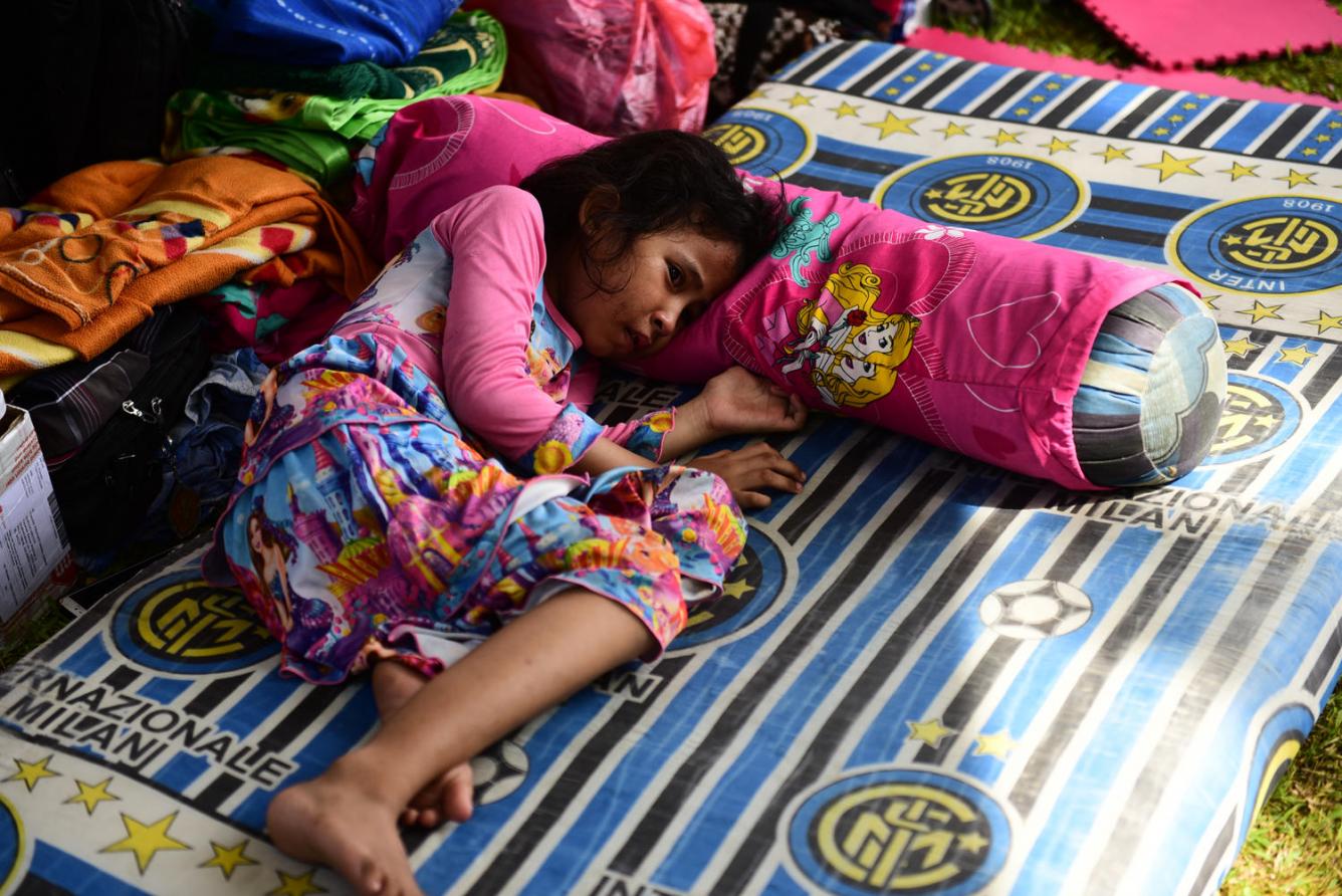 girl cries on mat, Indonesia