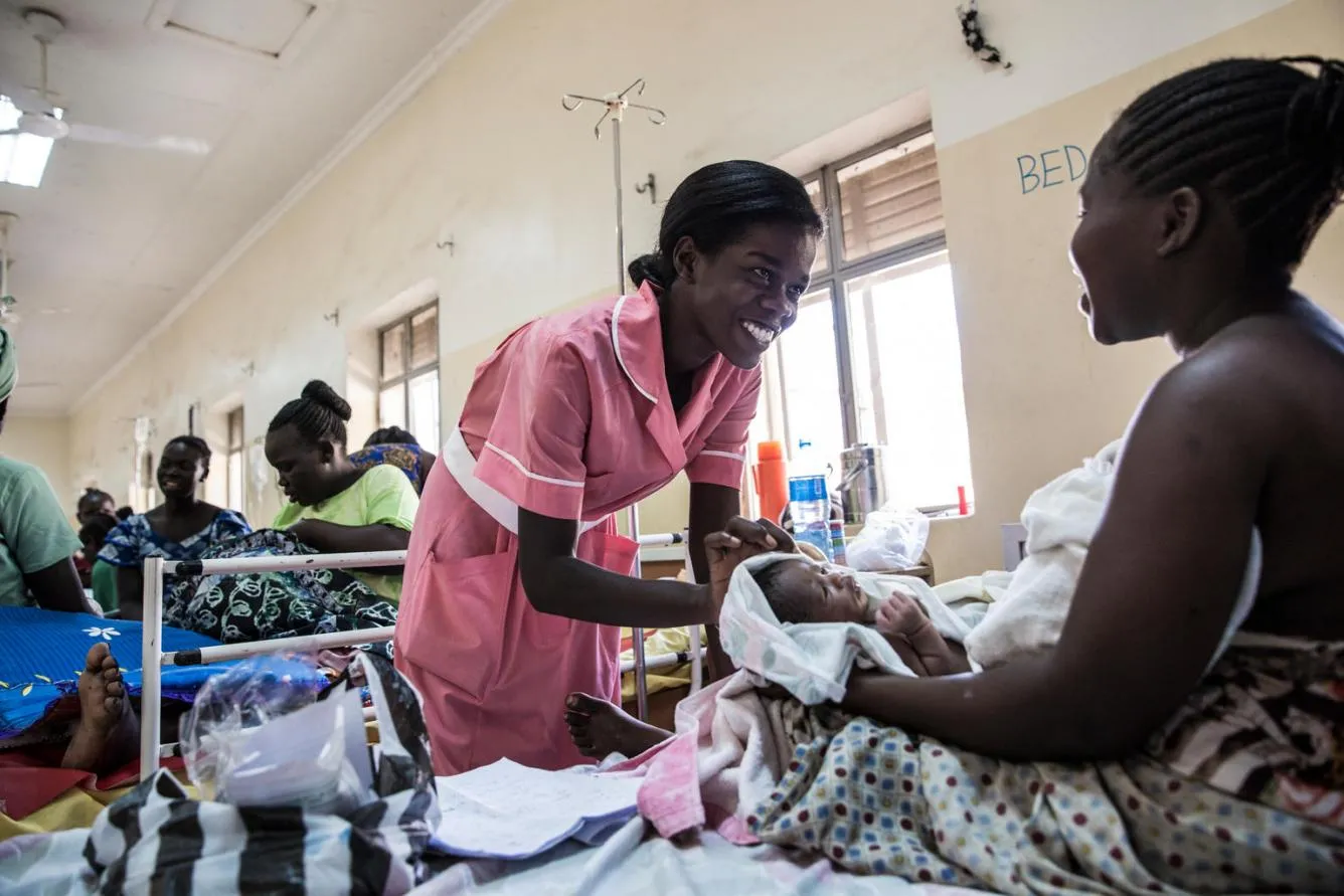 South Sudan midwife with mother