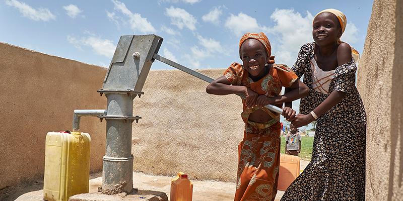 Girl with water pump