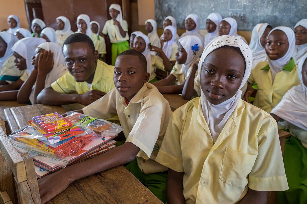 Students sit at their desks in a Junior High School classroom in Ghana.
