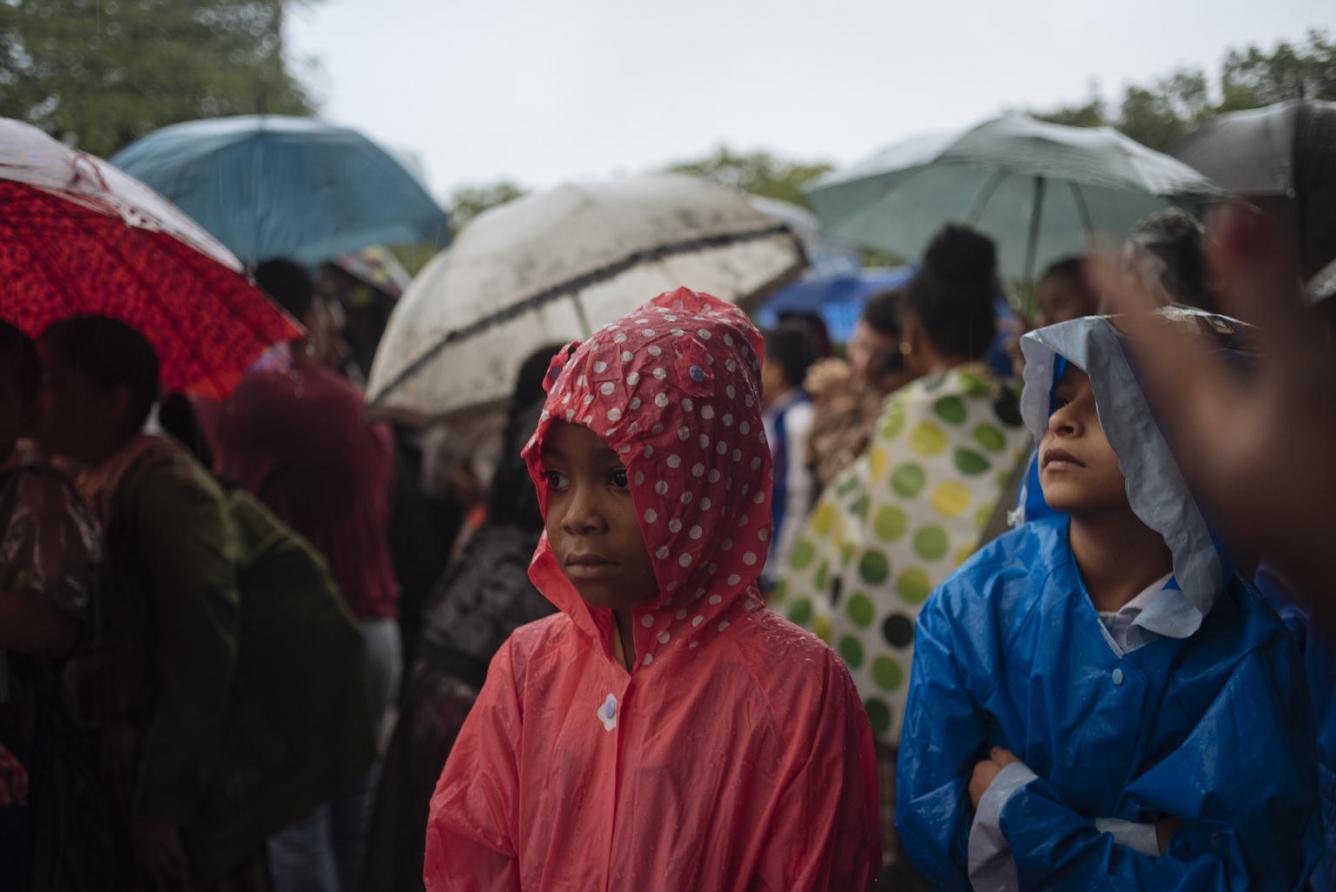 girl standing in the rain
