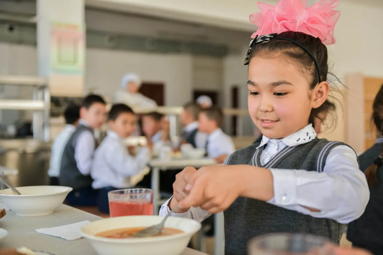 Yrysbibi, 9, eats lunch at a primary school in Turkestan city, Kazakhstan, where her mother is a teacher.