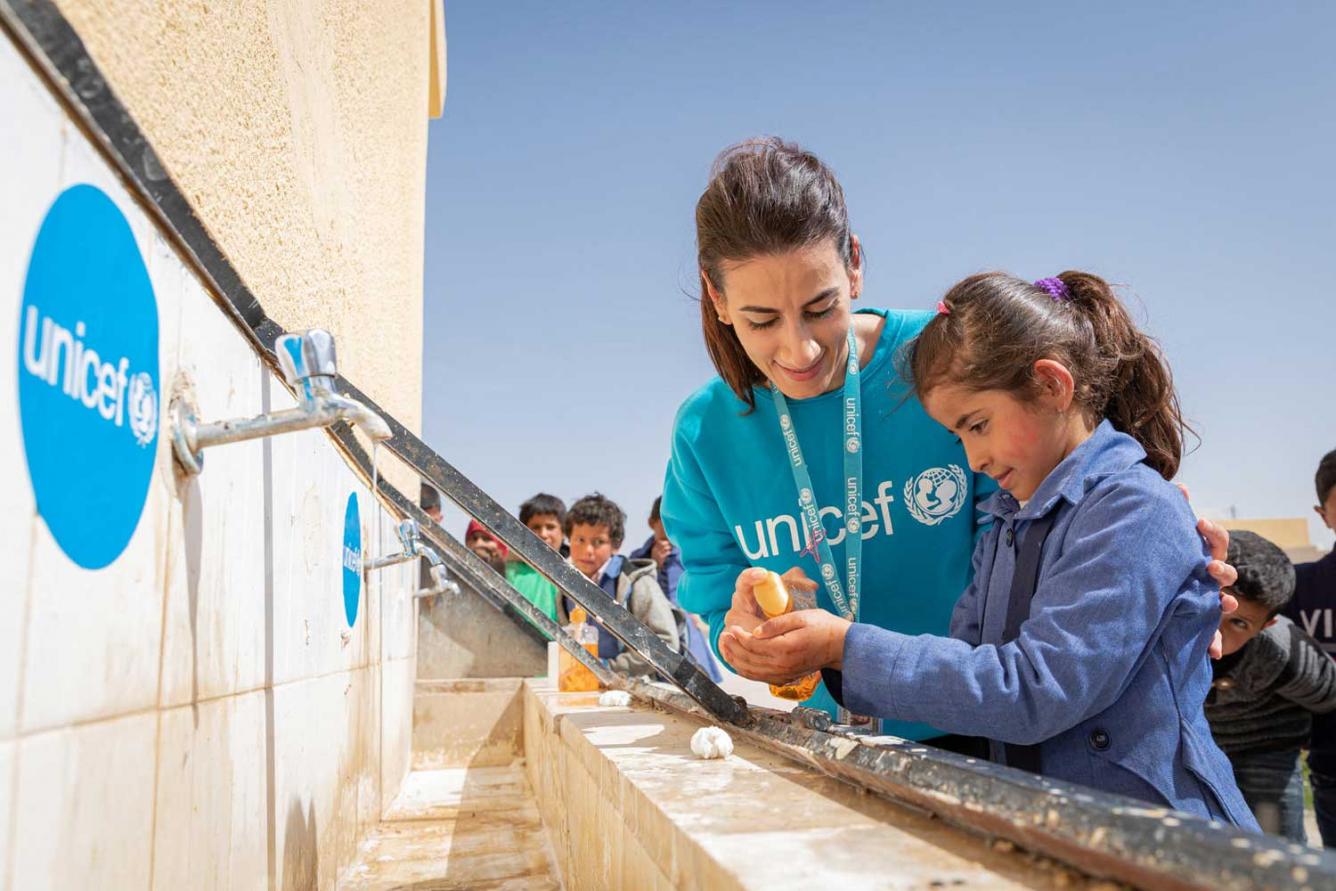 Children in Al Khader mixed primary school in Jordan take part in a hand-washing demonstration