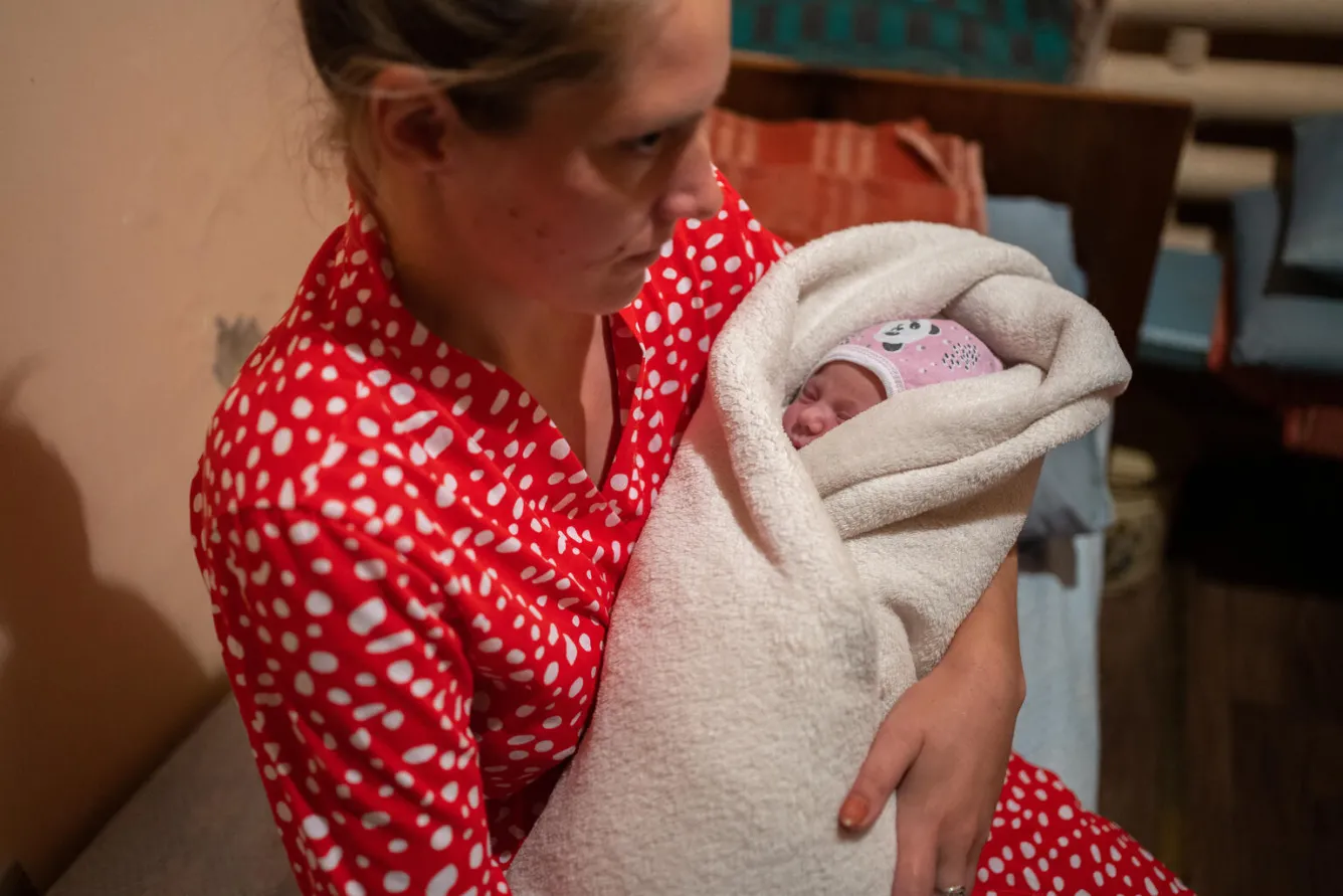 Оksana holds her daughter Hanna