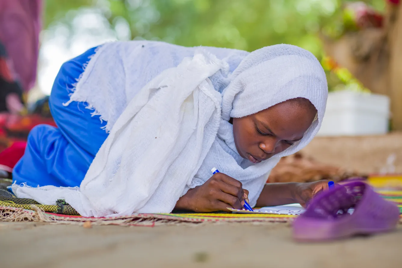 Displaced children engage in psychosocial activities at a gathering centre in Madani.