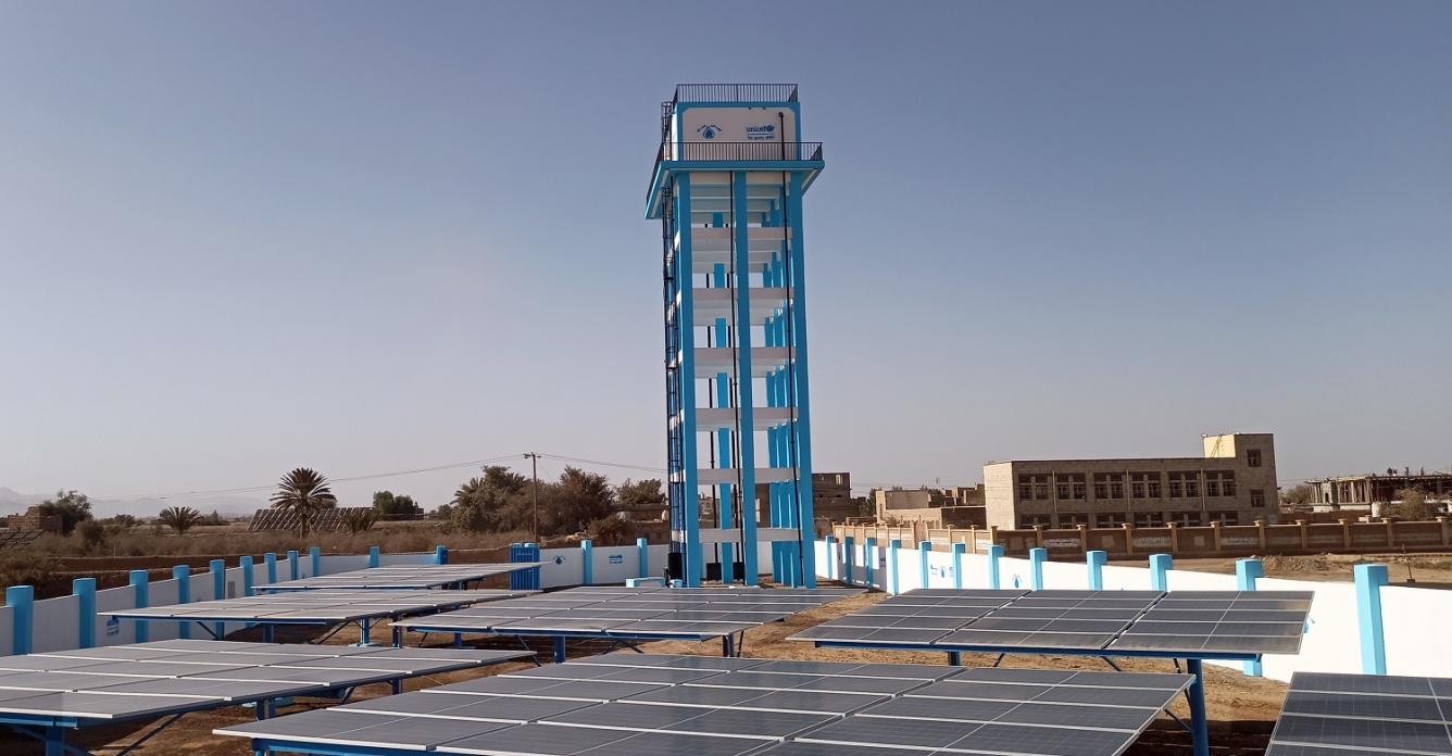 A solar-powered water system featuring a tower tank and solar panels in Yemen.