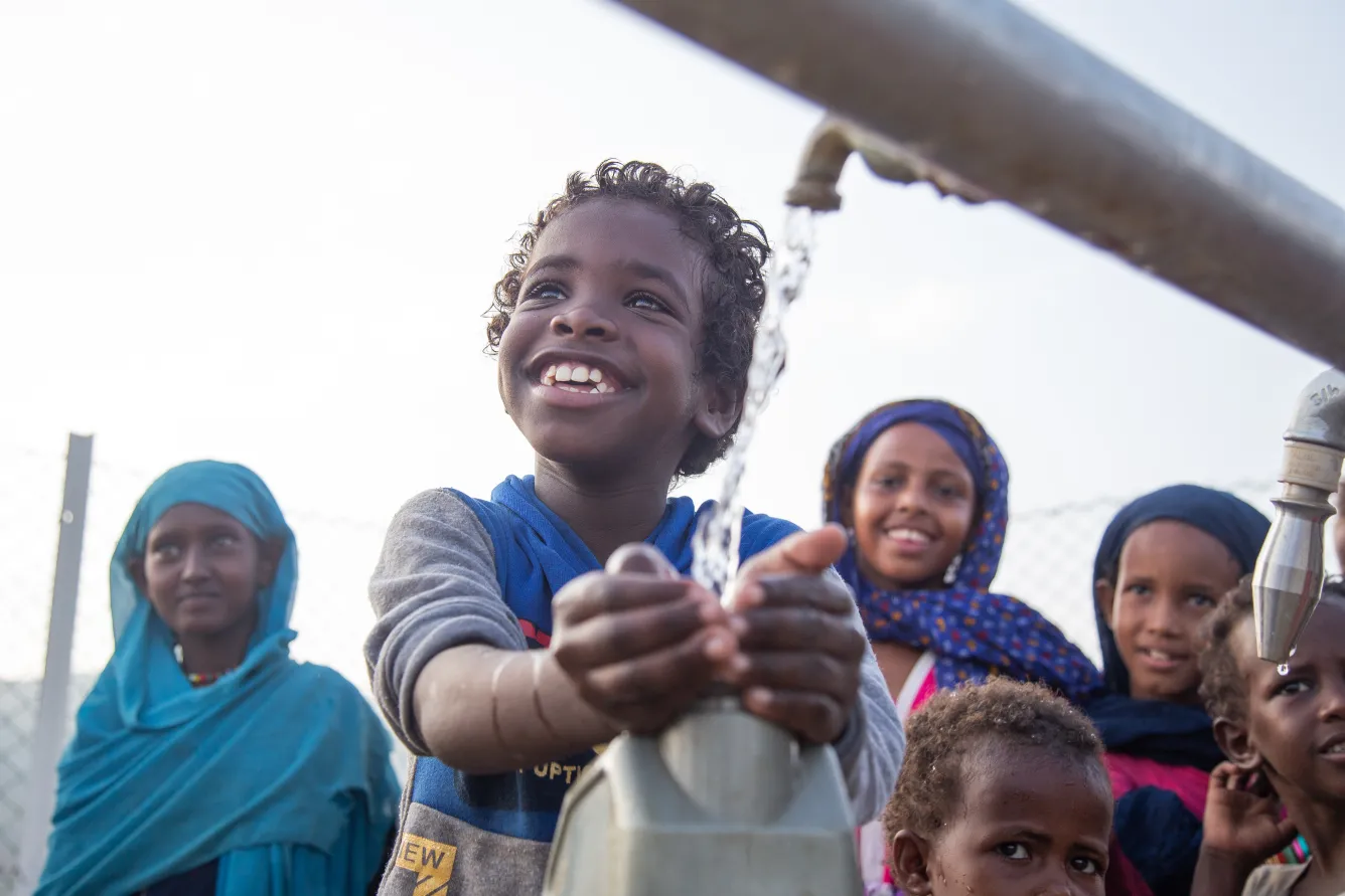 Children collect clean and safe water from a new water station in the small village of Gelhanty in Agig locality, Red Sea state.