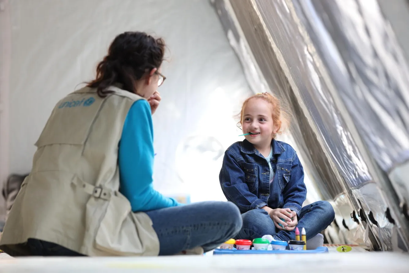 A UNICEF worker plays with a girl at a UNICEF-established children's corner in Goris, Armenia.