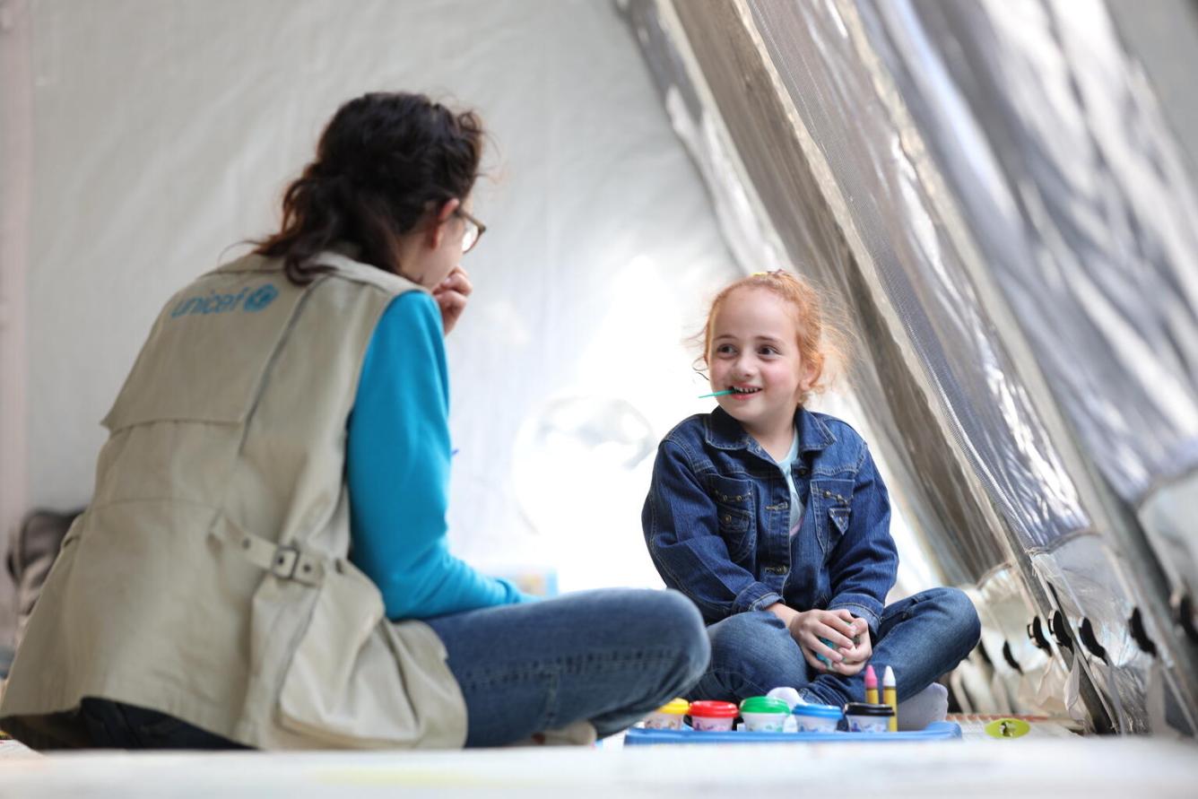 A UNICEF worker plays with a girl at a UNICEF-established children's corner in Goris, Armenia.