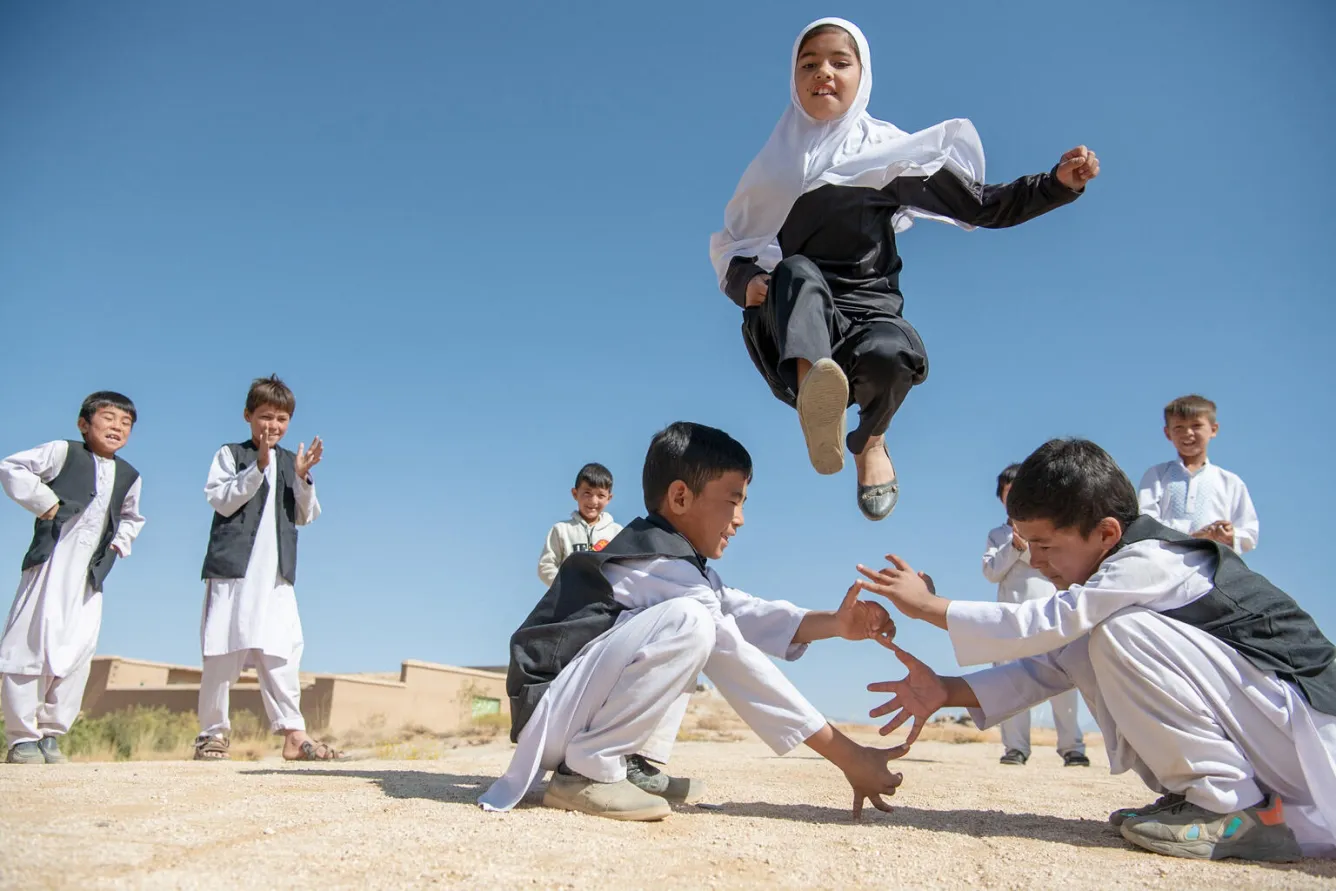 Khadija plays with her classmates at her community-based education class.