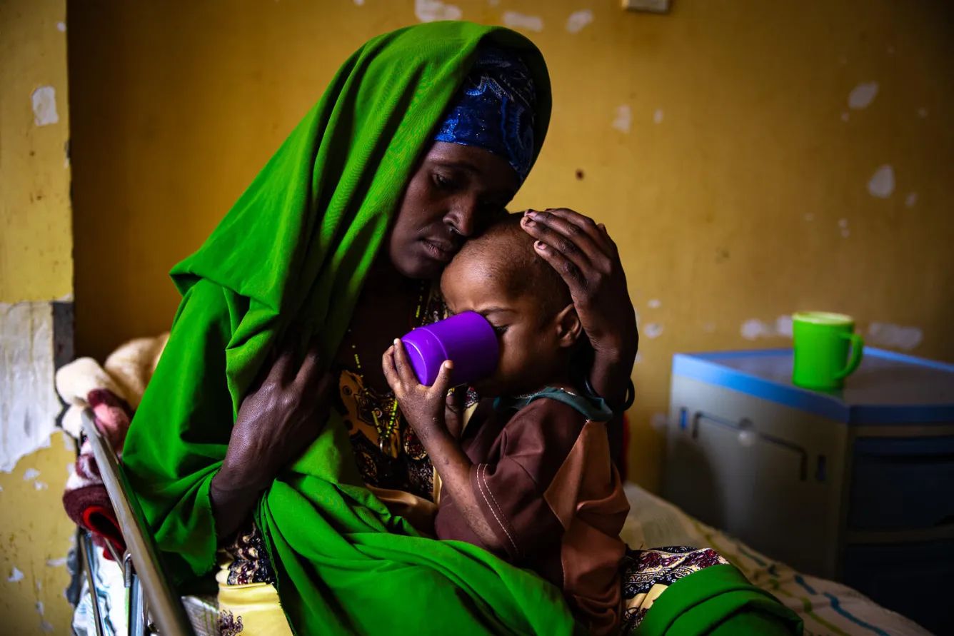  Four-year-old Mussab is held by his mother at the UNICEF-supported Jimma stabilization centre in Ethiopia.